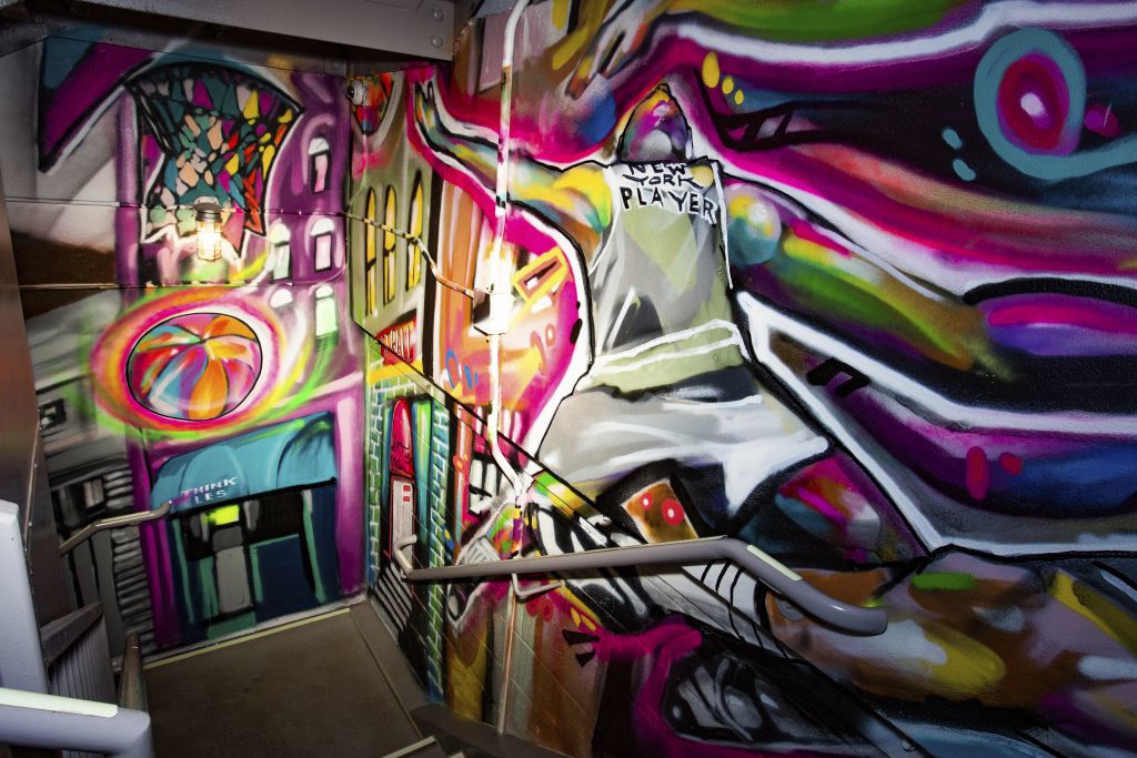 a stairwell enhanced with graffiti